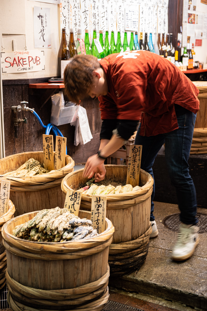 Man washing vegetables in the Kyoto market