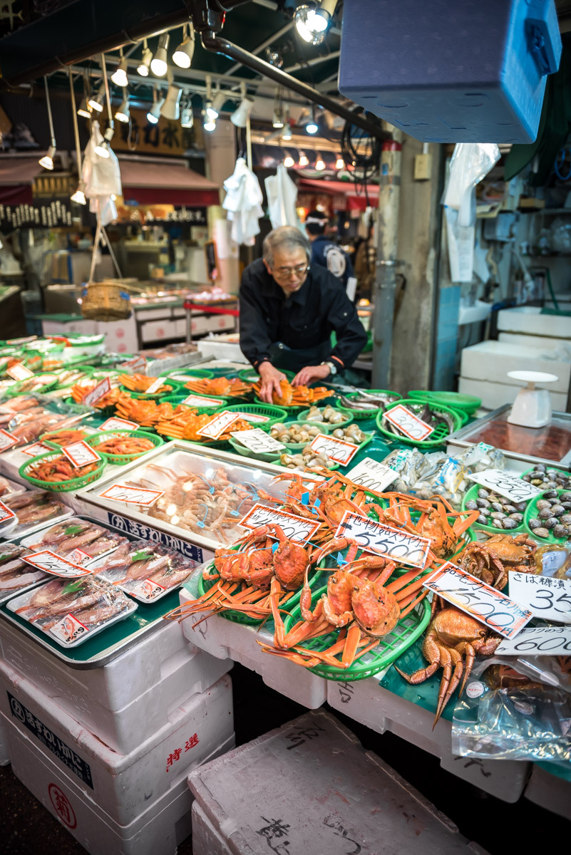Man selling fish at the market in Kanazawa