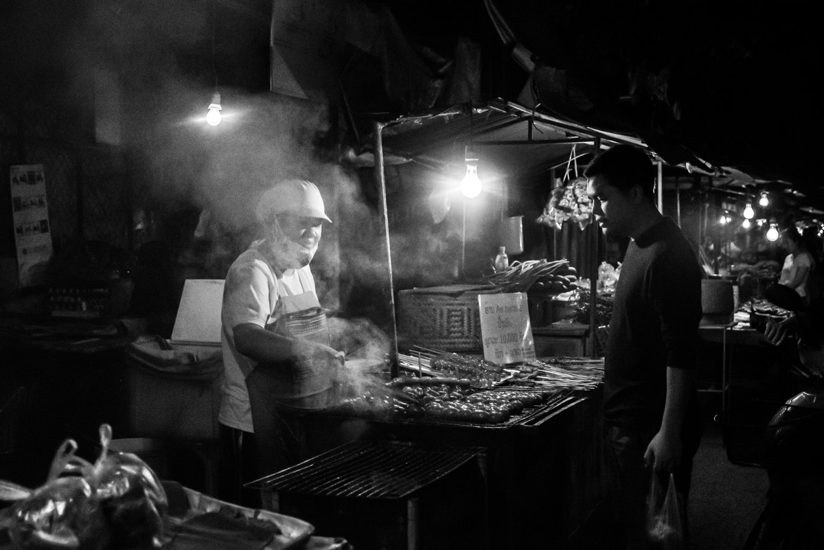 tips for street food photography - black and white image of a street food cart with steam