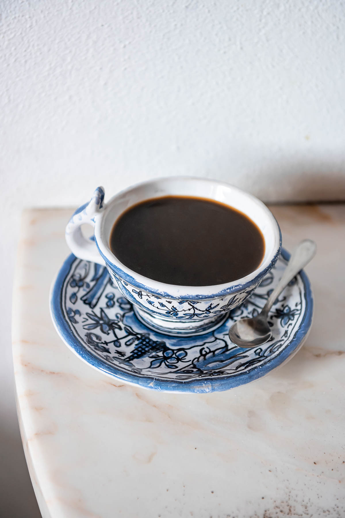 A cup of coffee in traditional Portuguese pottery